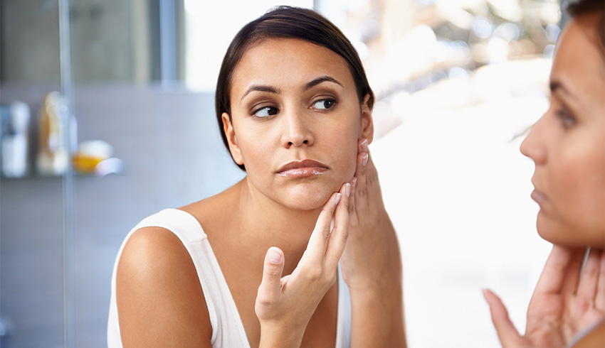 A woman looking in the mirror